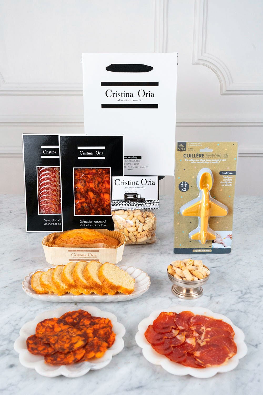 Saco de recém-mamã com produtos ibéricos e colher de avião