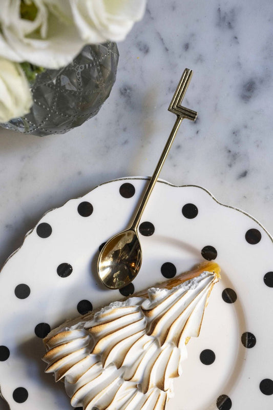 Cucchiaio in bronzo con iniziale L