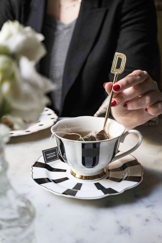 Cuillère dorée initiale D